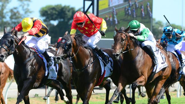 Boomsara (left), Bondi (middle) and outback Barbie fight out the Magic Millions Guineas at the Gold Coast. Picture: Trackside Photography