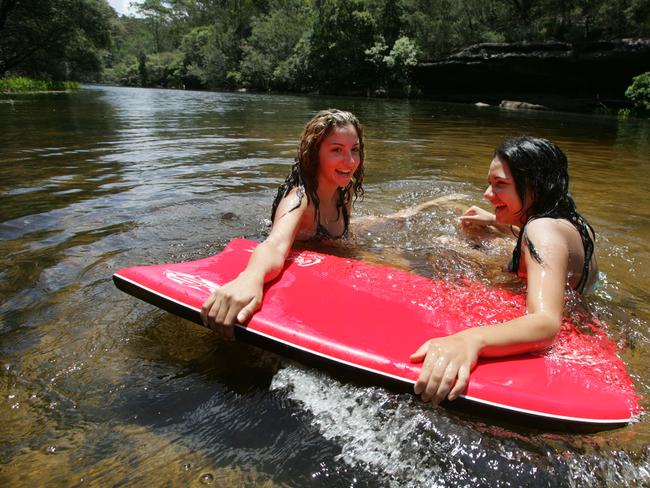 Rebecca Eid and Amelay Ozuner enjoy the water at Simmo's Beach on the Georges River.