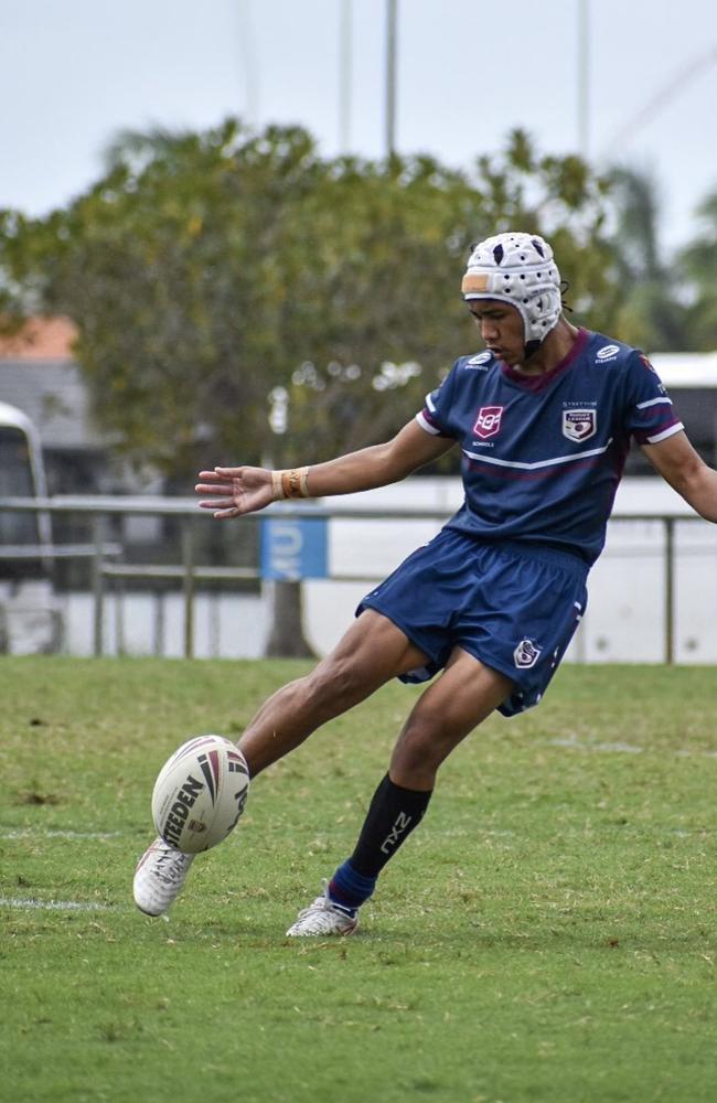 Dakoda Yung of Stretton State College kicks in general play.