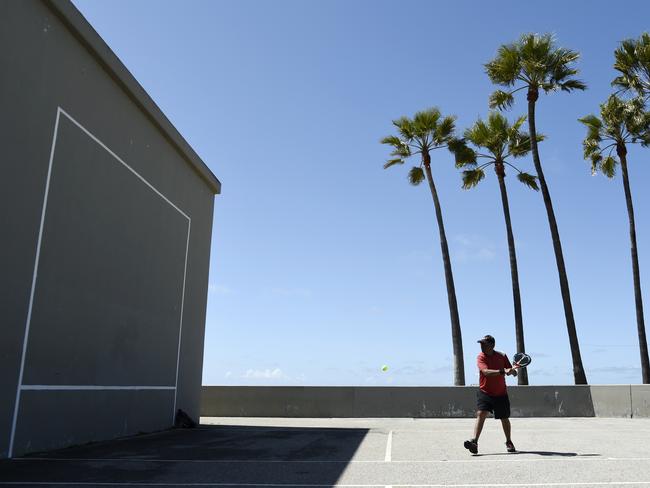 A solo racquetball player amid Los Angeles’ usually hectic, Venice Beach boardwalk. Picture: AP