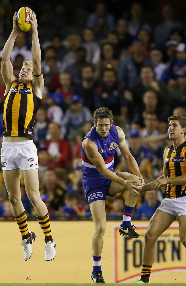 The moment when Robert Murphy injured his knee as James Sicily marks and kicks the winning goal. Picture: Micheal Klein