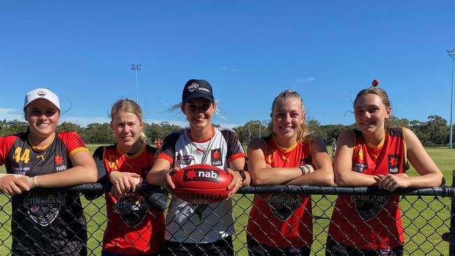 Dandenong Stingrays NAB League Girls team leaders (L-R) Jaide Anthony, Emily Shepherd, Abbey Jordan and Ash Richards with senior assistant coach Steph Binder (middle).