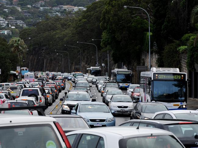 Traffic crawling along Spit Road during peak hour.