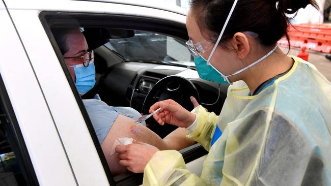 A man receives a dose of the Pfizer Covid-19 vaccine.