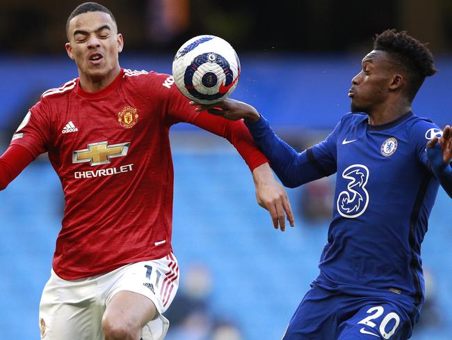 LONDON, ENGLAND - FEBRUARY 28: The ball hits the hand of Callum Hudson-Odoi of Chelsea as he is is challenged by Mason Greenwood of Manchester United which was reviewed by VAR during the Premier League match between Chelsea and Manchester United at Stamford Bridge on February 28, 2021 in London, England. Sporting stadiums around the UK remain under strict restrictions due to the Coronavirus Pandemic as Government social distancing laws prohibit fans inside venues resulting in games being played behind closed doors. (Photo by Ian Walton - Pool/Getty Images)