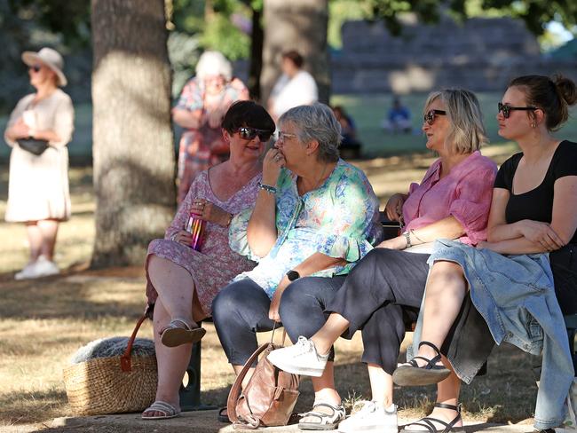 The community takes a quiet moment to reflect. Picture: Mark Stewart