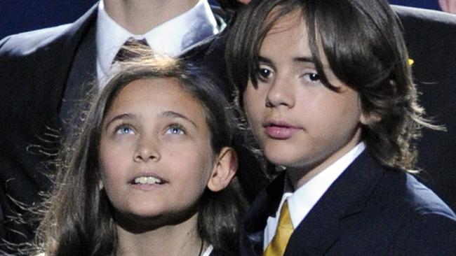 Michael Jackson’s children Paris and Prince stand together on stage during the memorial funeral service for their father.