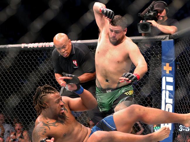 LAS VEGAS, NEVADA - JULY 10: Tai Tuivasa of Australia (top) takes down Greg Hardy in the first round in their heavyweight bout during UFC 264: Poirier v McGregor 3 at T-Mobile Arena on July 10, 2021 in Las Vegas, Nevada. (Photo by Stacy Revere/Getty Images)