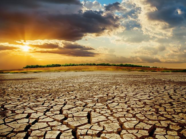 drought earth in sunset. dramatic sky over desert. change climate