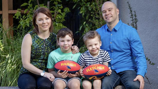 Renee and Sam Knight with their young sons Hamish, 7, and Fletcher, 5, at their Clarence Park Home. Picture: Emma Brasier