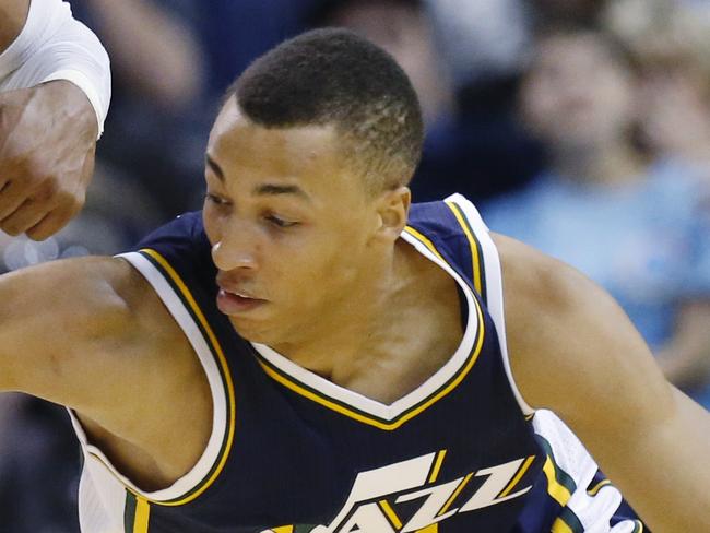 Oklahoma City Thunder guard Russell Westbrook (0) steals the ball from Utah Jazz guard Dante Exum (11) during the first quarter of a preseason NBA basketball game in Oklahoma City, Tuesday, Oct. 21, 2014. (AP Photo/Sue Ogrocki)