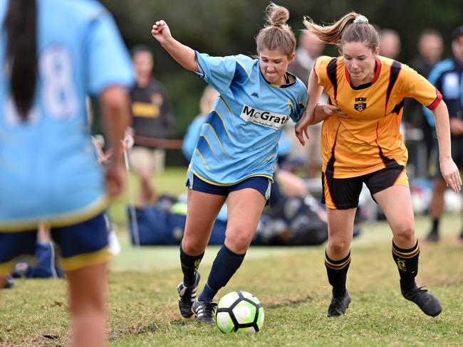 Beacon Hill's Loredana Vescio and Manly Allambie United's Casey Eagleton battle for possession during their Premier League soccer match at Miller's Reserve at Manly Vale. Football administrators say putting floodlights on more grounds will allow more time for training and games. Picture: Troy Snook