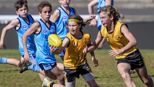 Action from the School Sport Australia Under-12 Football Championships between NSW and Western Australia. Picture: Roy VanDerVegt