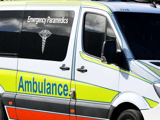 Emergency services attend a fatal car crash on the Bruce Highway, south of Townsville at Mount Surround. Garbage truck driver being looked over by paramedics.  Picture: Alix Sweeney