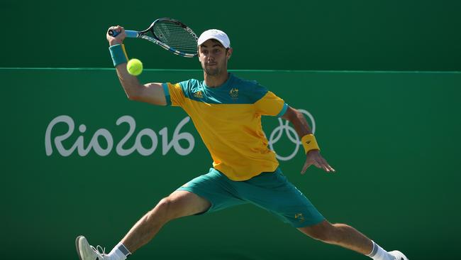 RIO DE JANEIRO, BRAZIL - AUGUST 06: Jordan Thompson of Australia in action against Kyle Edmund of Great Britain in the men's first round on Day 1 of the Rio 2016 Olympic Games at the Olympic Tennis Centre on August 6, 2016 in Rio de Janeiro, Brazil. (Photo by Julian Finney/Getty Images)