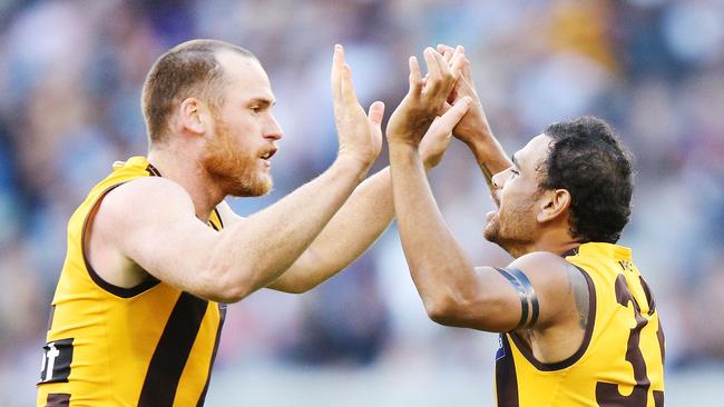 Jarryd Roughed and Cyril Rioli celebrate a goal.