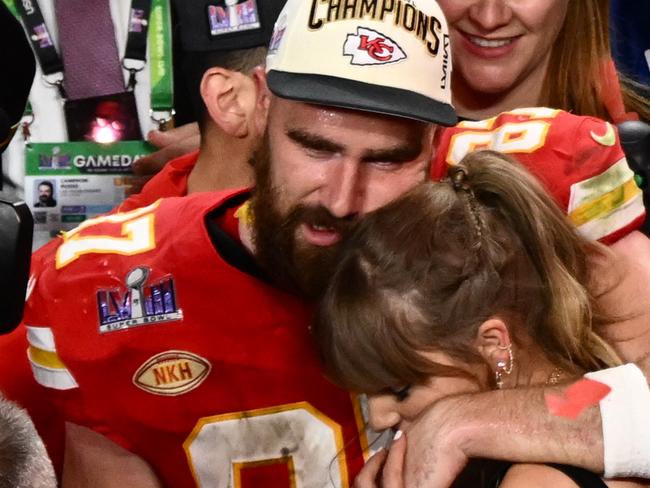 (FILES) US singer-songwriter Taylor Swift and Kansas City Chiefs' tight end #87 Travis Kelce embrace after the Chiefs won Super Bowl LVIII against the San Francisco 49ers at Allegiant Stadium in Las Vegas, Nevada, February 11, 2024. Kelce is helping survivors of the shooting that marred the Kansas City Chiefs' Super Bowl victory parade, after his world-famous girlfriend Swift did the same, NBC news reported on February 17, 2024. The shooting on February 14 left one woman dead and 22 people injured â including two girls in the Reyes family. Kelce's Eighty-Seven Running foundation made two $50,000 donations to a GoFundMe raising money to support the Reyes family, a Kelce representative confirmed to NBC. (Photo by Patrick T. Fallon / AFP)