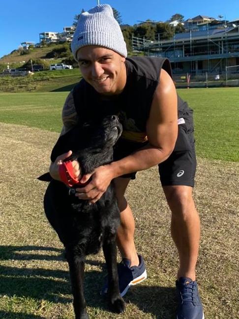 Kodi Nikorima cuddles up with Parker. Picture: Central Coast Animal Care Facility