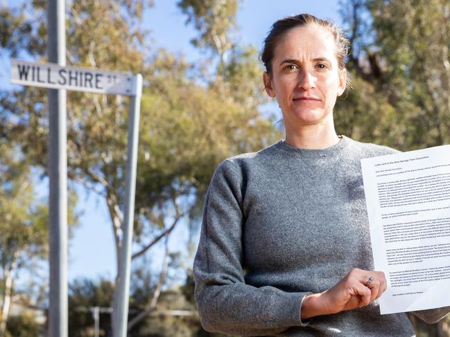 Suki Dorras-Walker with a letter she has written to the Alice Springs Town Council requesting that the name of Willshire Street be changed. Picture: Emma Murray