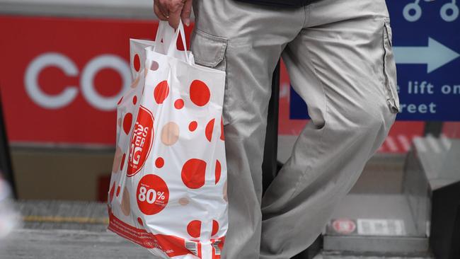 A shopper is seen carrying a reusable plastic bag at a Coles Sydney CBD store, Sydney, Monday, July 2, 2018. Woolworths says it will hand out free reusable bags for the next 10 days as its customers get used to its ban on single-use plastic bags. Woolies stores in NSW, Queensland, Victoria and Western Australia stopped providing free single-use plastic bags on June 20. (AAP Image/Peter RAE) NO ARCHIVING