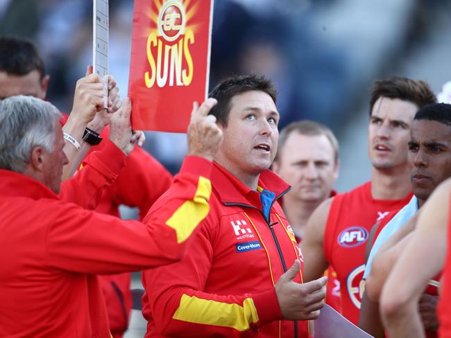 Suns head coach Stuart Dew speaks to his team during a quarter time break during the round 23 AFL match between the Geelong Cats and the Gold Coast Suns at GMHBA Stadium on August 25, 2018 in Geelong, Australia. (Photo by Scott Barbour/AFL Media/Getty Images)