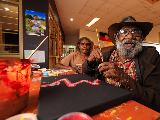 Helicopter Tjungurrayi with his granddaughter Stephanie Yukenbarri at the Warlayirti Art Centre in Balgo. Picture: Adam Head