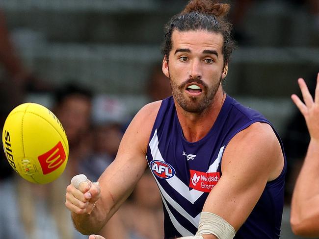 PERTH, AUSTRALIA - MARCH 02: Alex Pearce of the Dockers handballs the ball during the AFL Practice Match between the Fremantle Dockers and the Port Adelaide Power at Fremantle Oval on March 02, 2023 in Perth, Australia. (Photo by James Worsfold/AFL Photos/via Getty Images)