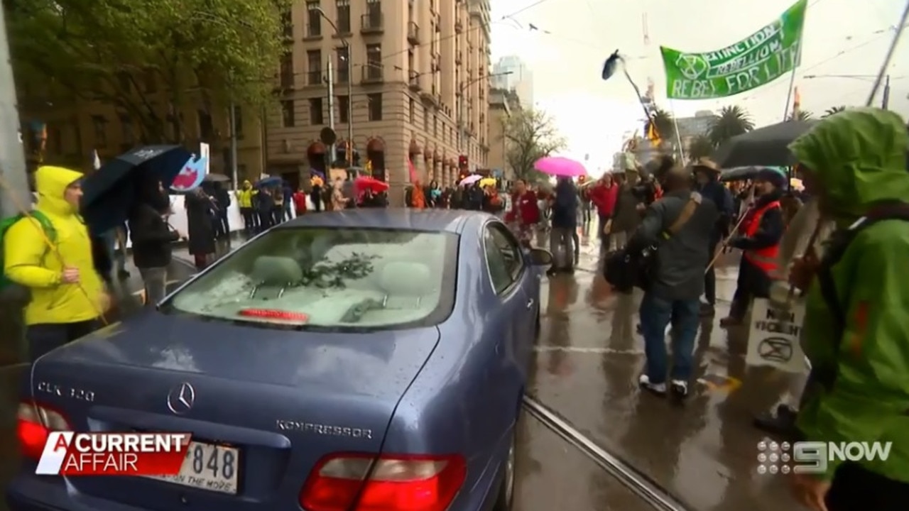 She starts to drive through the crowd.