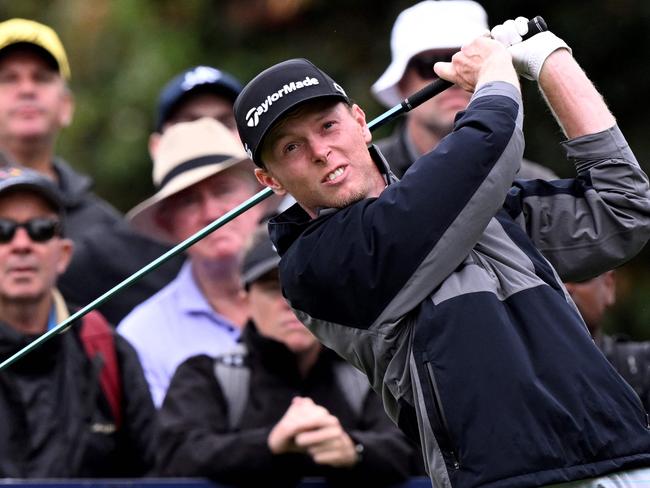 Ryggs Johnston of the US tees off during the third round of the 2024 ISPS Handa Australian Open Golf tournament at the Kingston Heath Golf Club in Melbourne on November 30, 2024. (Photo by William WEST / AFP) / --IMAGE RESTRICTED TO EDITORIAL USE - STRICTLY NO COMMERCIAL USE--