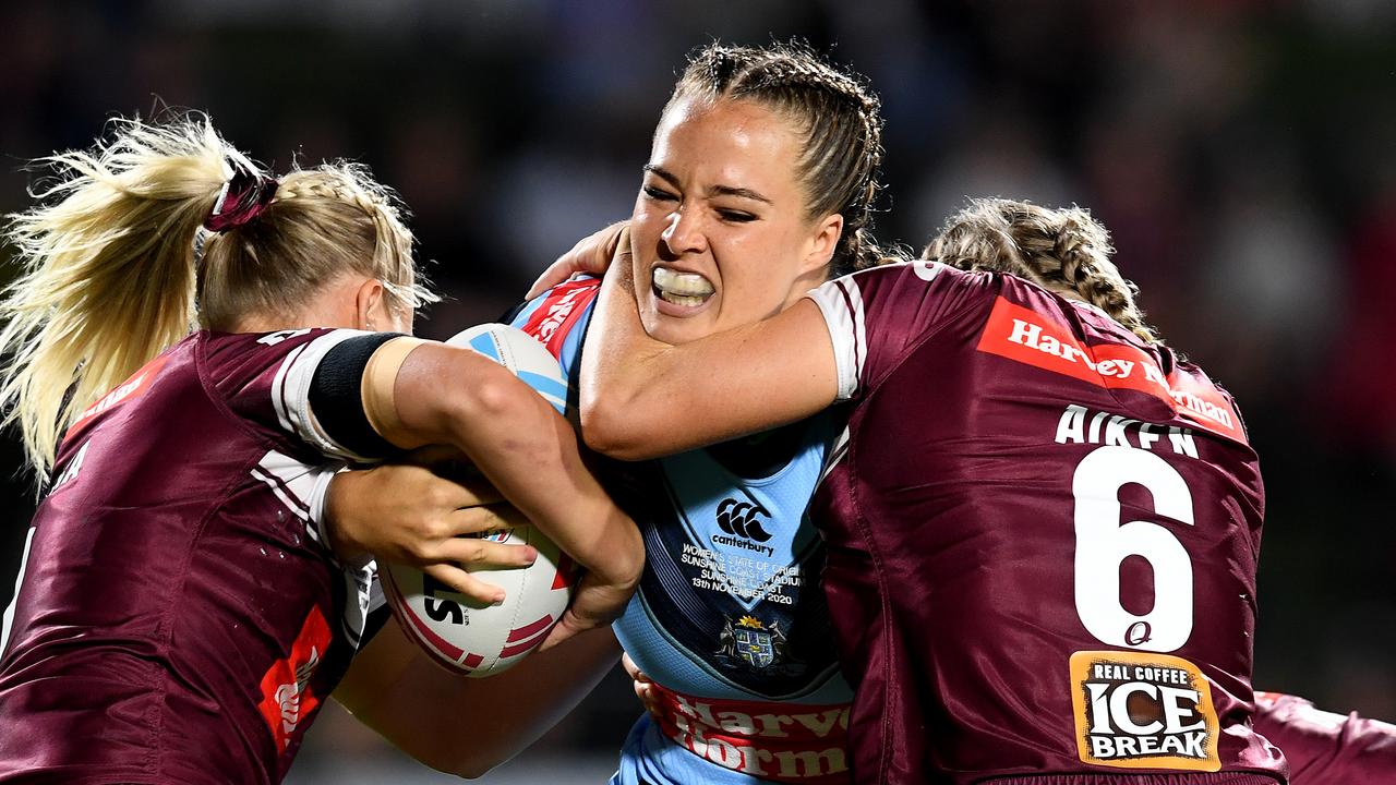 SUNSHINE COAST, AUSTRALIA – NOVEMBER 13: Isabelle Kelly of the NSW Blues is tackled during the Women's State of Origin match between Queensland and New South Wales at Sunshine Coast Stadium on November 13, 2020 in Sunshine Coast, Australia. (Photo by Dan Peled/Getty Images)