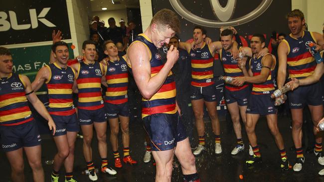 Adelaide ruckman Reilly O'Brien in the changerooms after playing in his first AFL win for the club in 2016. Picture: Sarah Reed