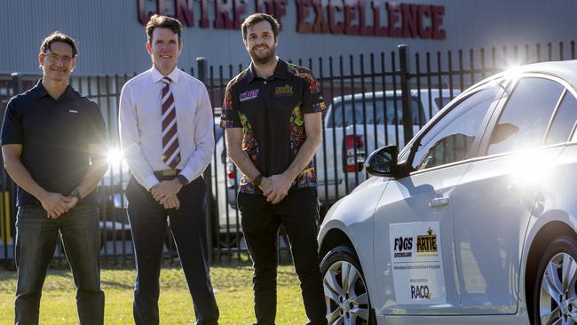 RACQ’s David Contarini with Marsden High principal Andrew Peach and Steven Page with the new car which is part of a program run by the Artie Beetson Academy, celebrating its 10th anniversary. Picture: Sarah Marshall