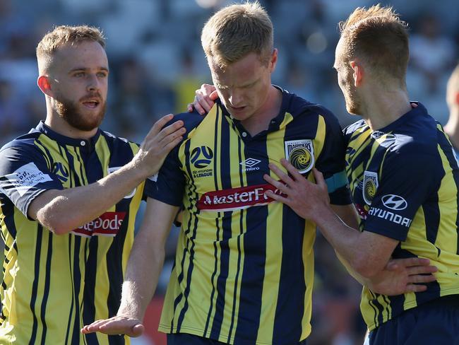 GOSFORD, AUSTRALIA - DECEMBER 01: Matt Simon of the Mariners celebrates his goal with team mates Connor Pain and Jack Clisby  during the round six A-League match between the Central Coast Mariners and Sydney FC at Central Coast Stadium on December 01, 2018 in Gosford, Australia. (Photo by Ashley Feder/Getty Images)