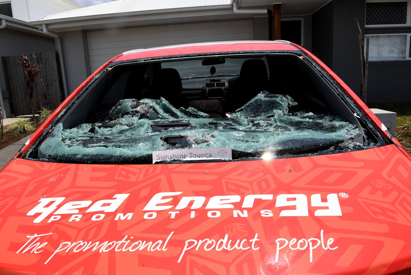 Cleaning up after the Sunday storm on the Sunshine Coast Coast.Hail damage in Aura Estate