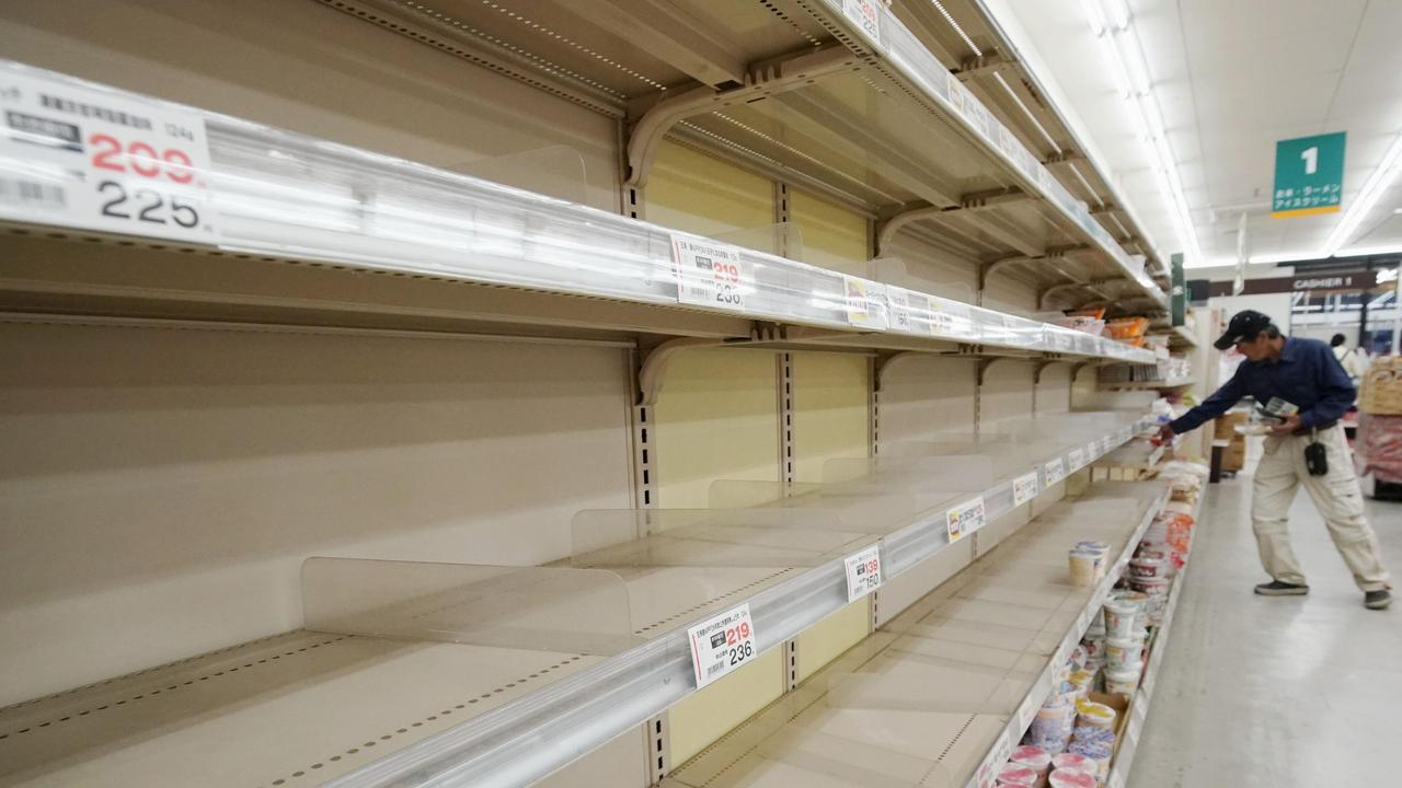 A man shops near empty shelves at a supermarket in Tateyama, Chiba prefecture, near Tokyo. Picture: Naoya Osato/Kyodo News via AP