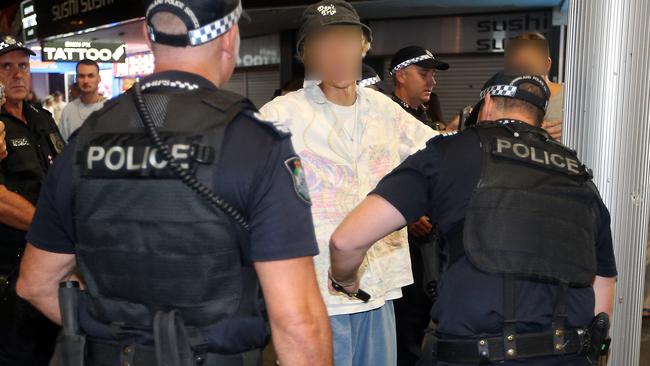 Police in Surfers Paradise 'wanding' revellers for knives. Picture: Richard Gosling