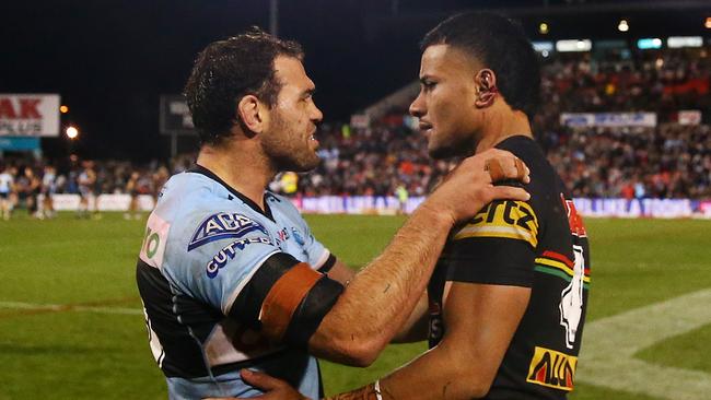 Dale Finucane of the Sharks looks at the ear of Stephen Crichton (Photo by Matt Blyth/Getty Images)