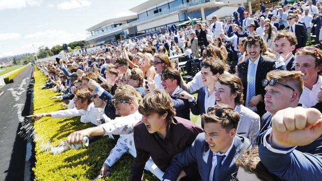 Punters in the general admission section at Royal Randwick go crazy after backing the winner at The Everest. Picture: Sam Ruttyn