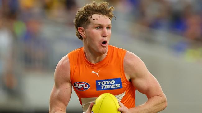 PERTH, AUSTRALIA - MARCH 24: Tom Green of the Giants looks for options as he runsdown the field during the round two AFL match between West Coast Eagles and Greater Western Sydney Giants at Optus Stadium, on March 24, 2024, in Perth, Australia. (Photo by James Worsfold/AFL Photos/via Getty Images )