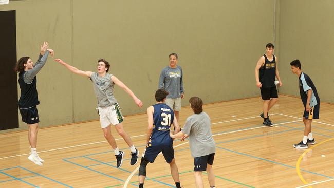 Kevin Goorjian coaching the Box Hill Senior Secondary College basketball team.