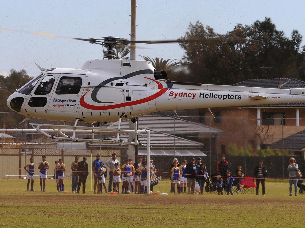 The helicopter landed at a park in Lidcombe where young children were playing soccer. Picture: Toby Zerna