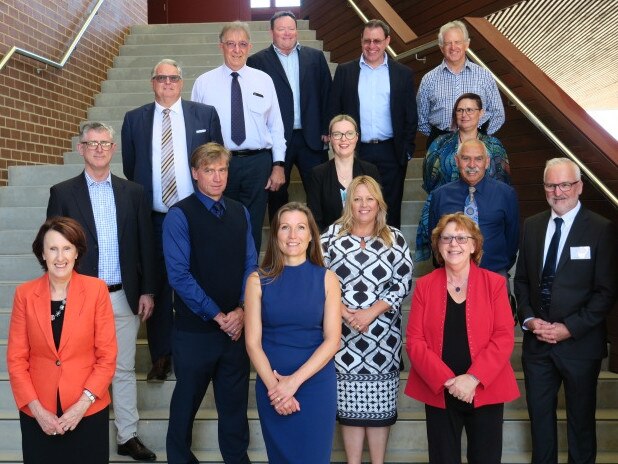 Proud CSU staff and dignitaries on the steps of the new $66 billion building