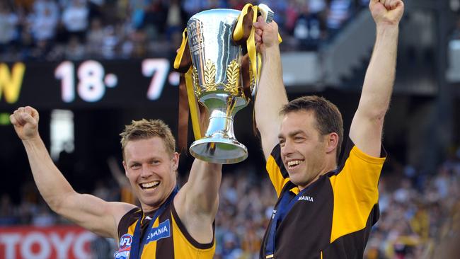 Hawthorn captain Sam Mitchell and coach Alastair Clarkson with the 2008 premiership cup.