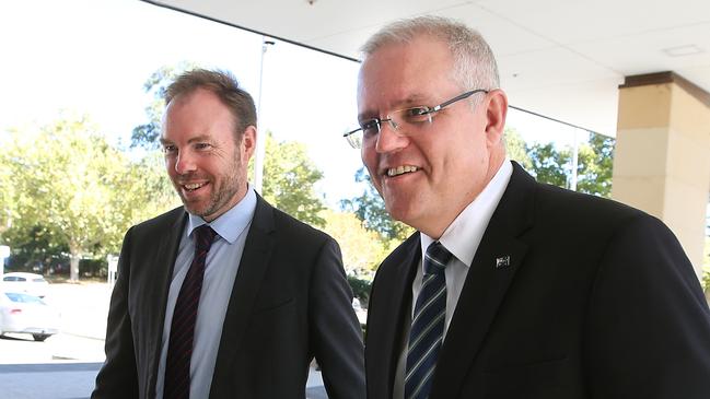 Deputy Secretary of Fiscal Group at Treasury Michael Brennan meeting Treasurer Scott Morrison as he arrives at the Treasury Building in Canberra. Picture Kym Smith