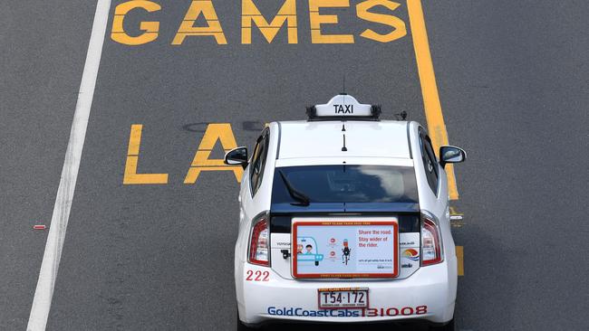 A Taxi drives on a designated Commonwealth Games Lane (AAP Image/Dave Hunt)