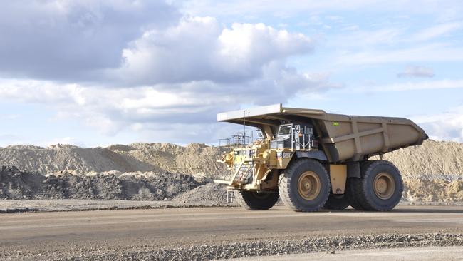 A dump truck heads out of a pit at the New Acland coalmine in Queensland. Picture: Stuart Cumming