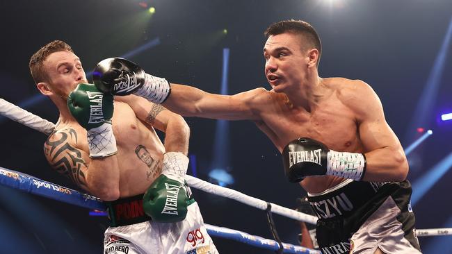 Tim Tszyu launches at Dennis Hogan during the WBO Global Super Welterweight title fight at Newcastle Entertainment Centre. Picture: Getty Images