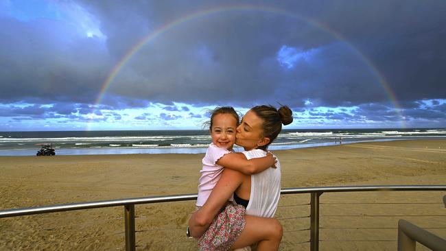 Victorians Daisy Coote and daughter Cressida, 5, at Burleigh Heads on the Gold Coast. Picture: Lyndon Mechielsen