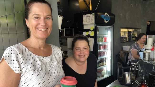 Loyal customer Fay Hadley, gets her last cup of coffee from Maria, the owner of the popular Mr Grigor's cafe and restaurant at Allambie Heights. Picture: Jim O'Rourke