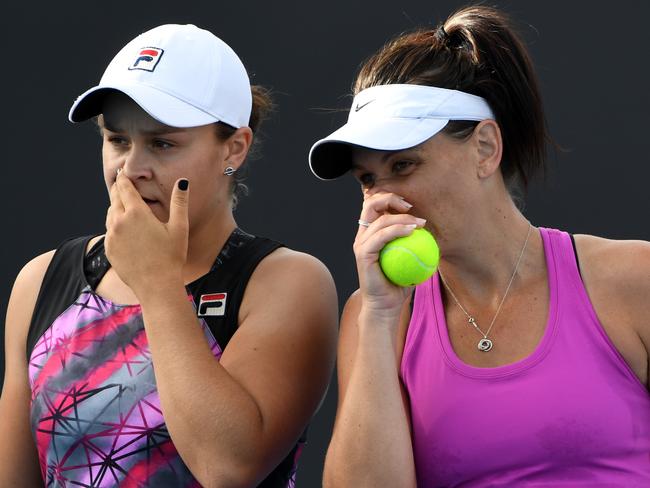 Ashleigh Barty of Australia and Casey Dellacqua of Australia in action against Lyudmyla Kichenok of Ukraine and Nadiia Kichenok of Ukraine during the Womens Doubles round 1 match on day four of the Australian Open in Melbourne, Thursday, Jan. 19, 2017. (AAP Image/Lukas Coch) NO ARCHIVING, EDITORIAL USE ONLY